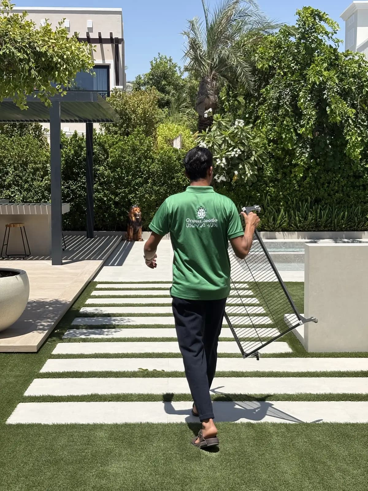 Weekly garden maintenance at a private villa lawn